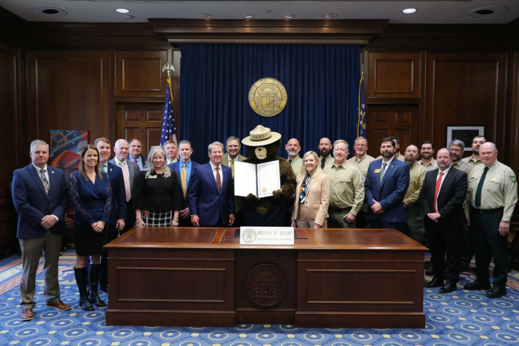Smokey the Bear, Governor Kemp, Rep. Leesa Hagan, Forestry Commission Director Johnny Sabo, DNR Commissioner Walter Rabon receiving a proclamation for Prescribed Burn Awareness Day